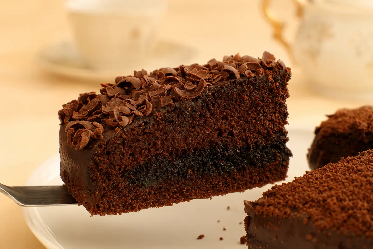 Slice of chocolate cake with chocolate shavings