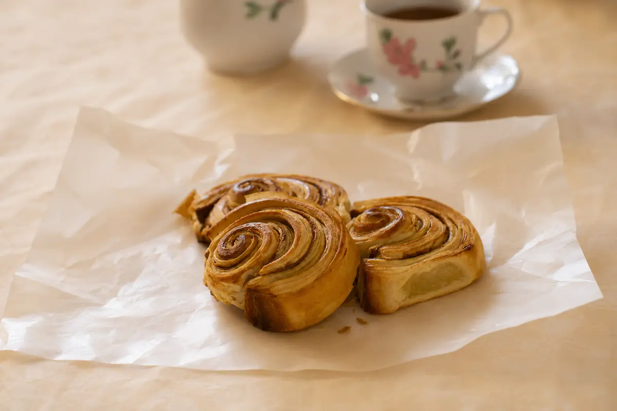 Golden spiral pastries served with tea